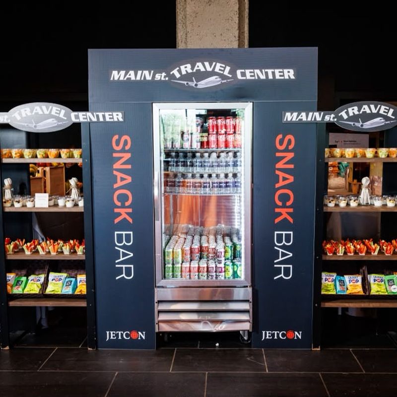 The branded Main St Travel Center snack bar and drinks fridge